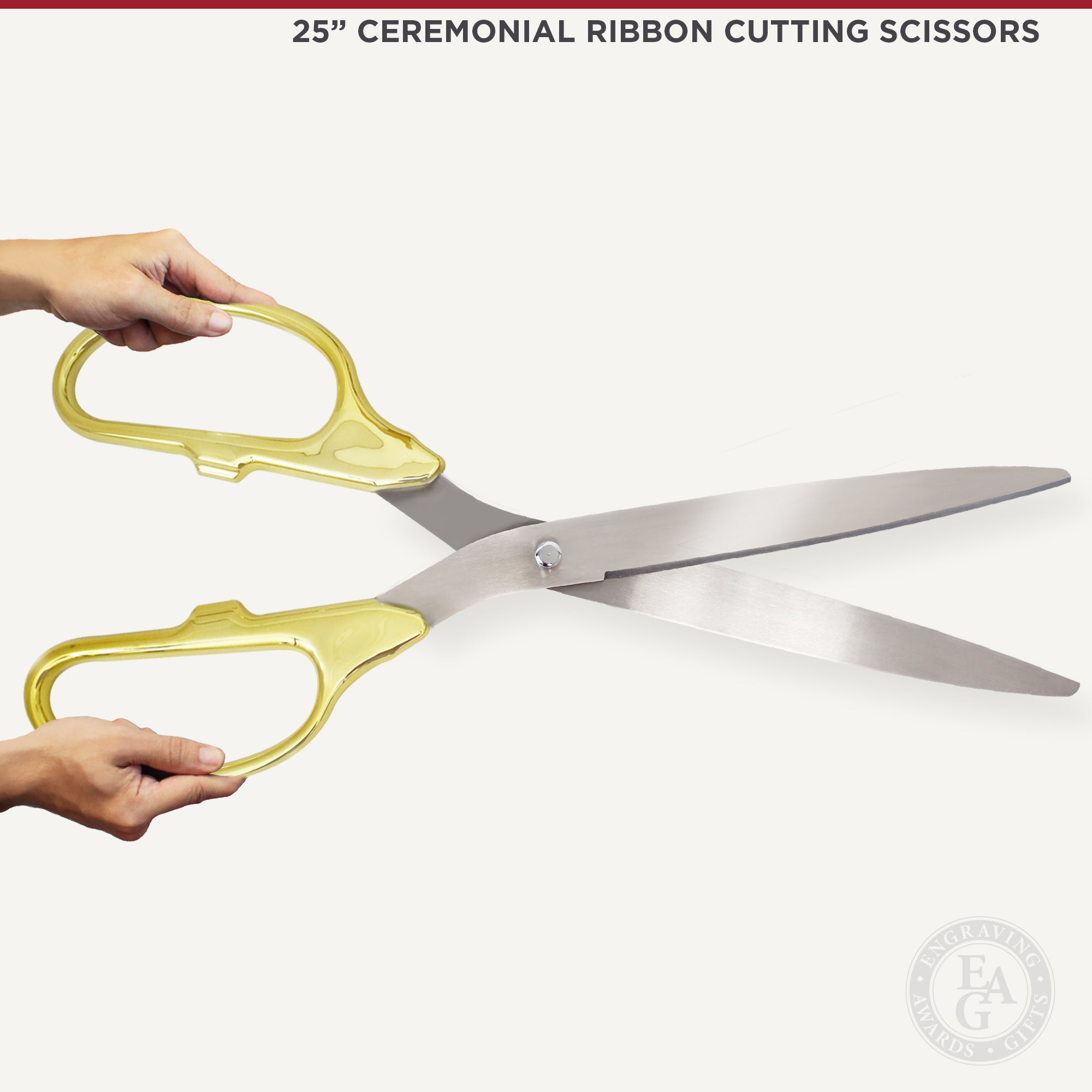 Hand Holding Golden Pair of Ribbon Scissors Isolated on White Ba
