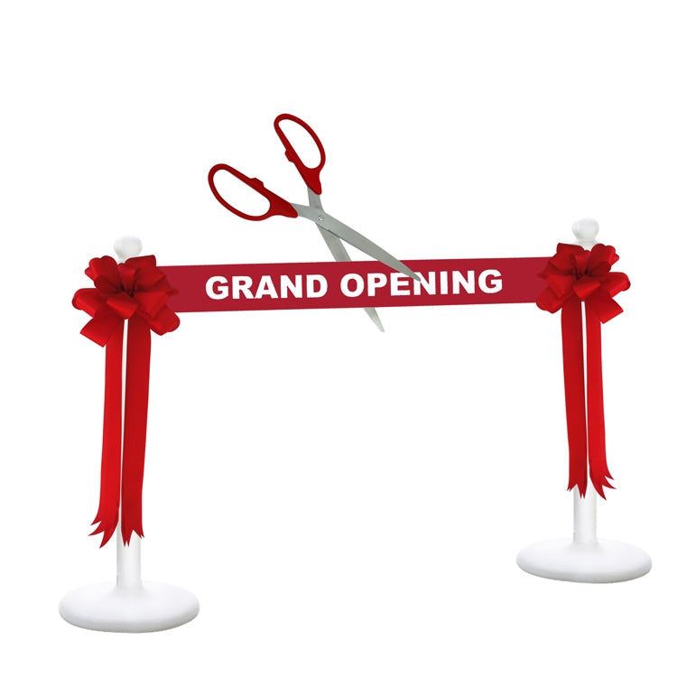 Grand Opening with a scissors and red ribbon on a white background